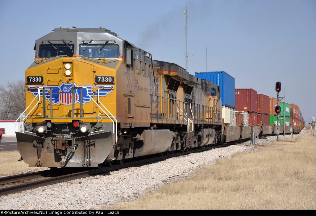 Westbound stack train eases out of the siding